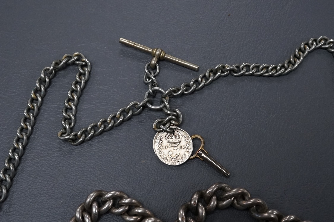 A late Victorian silver open faced key wind pocket watch, with Roman dial and subsidiary seconds, case diameter 52mm, on a heavy silver curb link albert, hung with a silver vesta case and a watch key, together with a con